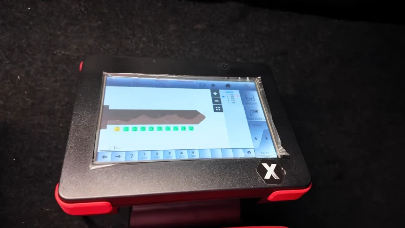 Locksmith programming a transponder car key on-site in Las Vegas