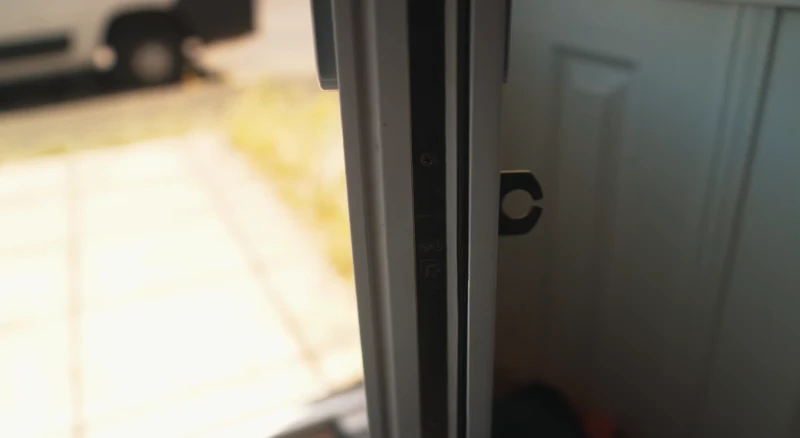 Las Vegas residential locksmith installing a new door lock in Henderson